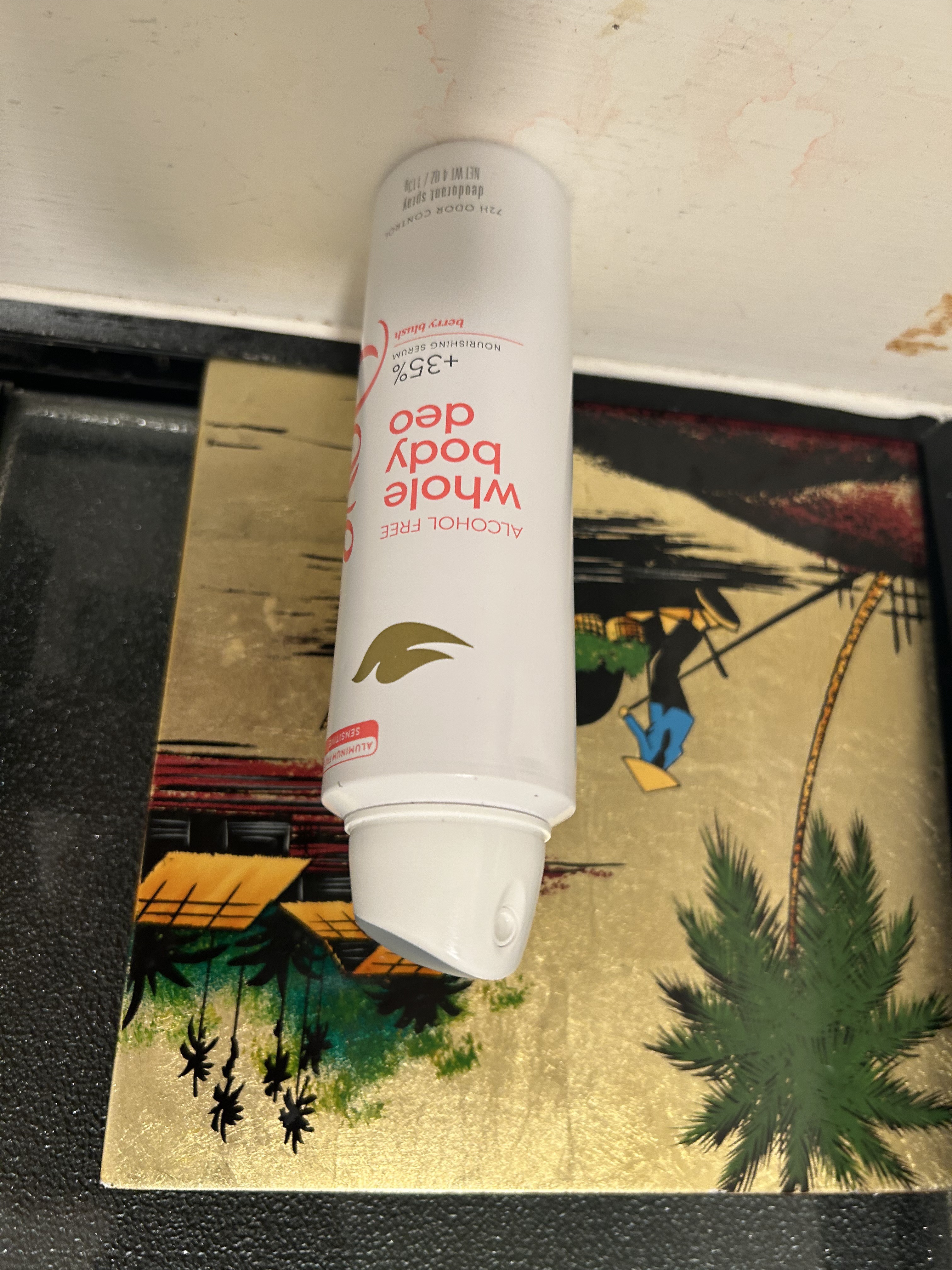 Dove Berry Blush Whole Body Deo on gold tropical painting